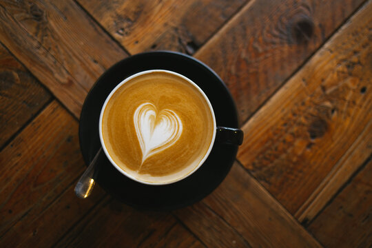 Cappuccino on the wooden table