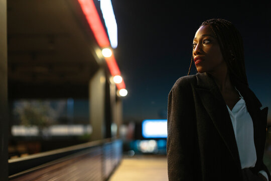 Attractive woman outdoors at night