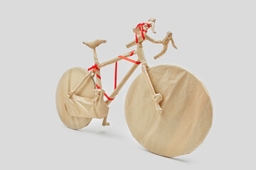 Creative present on birthday bike wrapped craft paper.