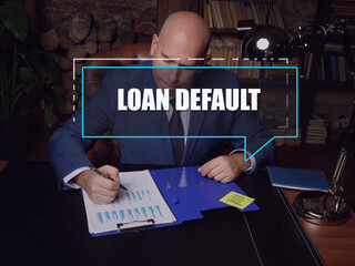  LOAN DEFAULT phrase on the screen. Auditor checking financial report Loan default occurs when a...