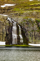 Fototapeta na wymiar Mountain lake waterfall Flotvatnet Norway