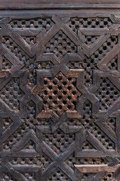 Traditional ornate carved on the wooden door in morocco