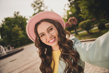 Portrait of pretty positive young person take selfie toothy smile enjoy free time walking park outdoors