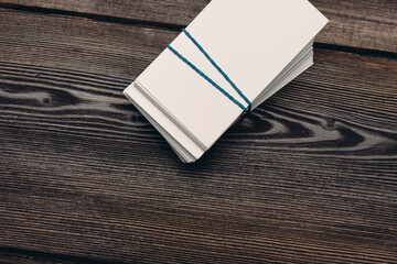 bundles of business cards on a wooden background top view work finance