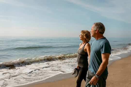 Mature couple walking on the beach