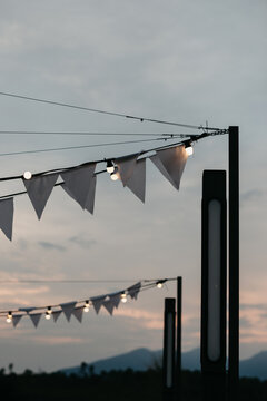 White bunting flags with string lights