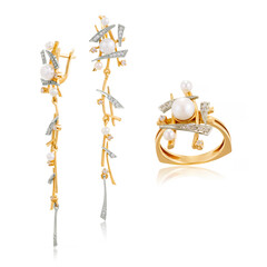 Set of earrings and ring in yellow gold with pearls. Jewelry close-up on a white background with reflection.