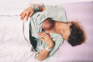 Fototapeta Mother and newborn. Child birth in maternity hospital. Young mom hugging her newborn baby after delivery. Woman giving birth. obraz