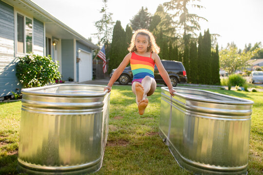 Girl swings on edge of pools
