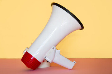 megaphone on a yellow background. close-up