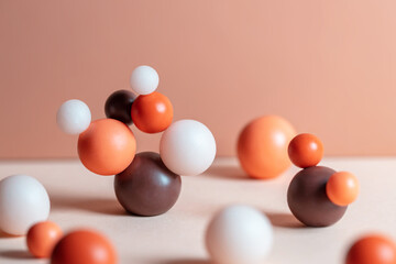 Modern composition with pastel round objects. Minimalistic geometric balls on white and beige background. Still life with harmony and balance concept.