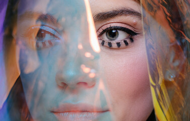 Beauty portrait with transparent holographic foil