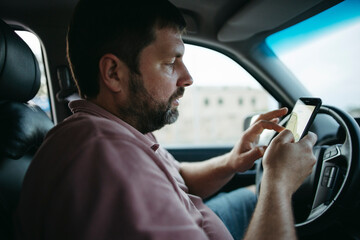A man chooses a car route. Family trip by car.