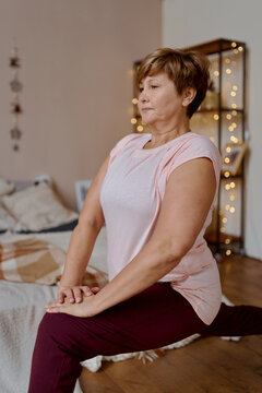 adult yoga woman coach doing christmas yoga at home