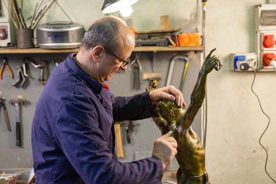 Craftsman repairing a statue