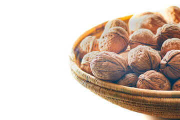 Walnut basket near the window creating white background