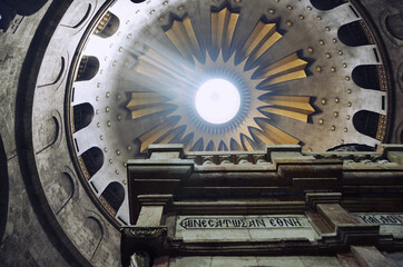 Israel, Jerusalem: Bottom-up view on the dome of the church with sunshine ray