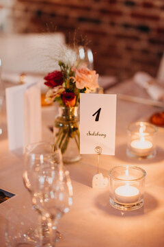 Beautiful table number 1 (Salzburg) set indoors for reception with candles lit
