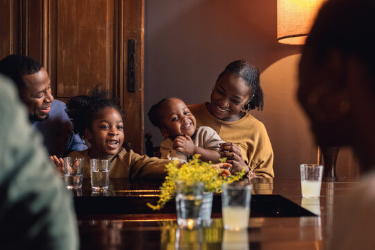 A Family Laughing in a Restaurant