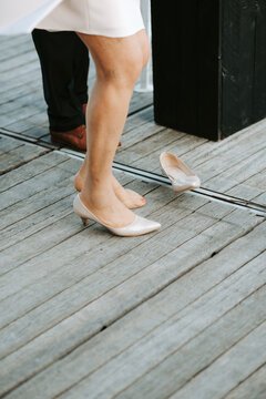 elder woman with stockings got stuck with high heel