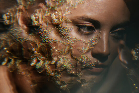 Multi exposure portrait of woman with lace flowers