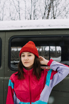 Portrait Of Young Woman In Red Hat Wearing Vintage Style Tracksuit
