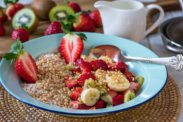 Muesli with fresh fruits and roasted nuts in a bowl