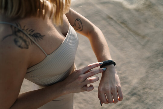 Close up of woman checking her fitness tracker