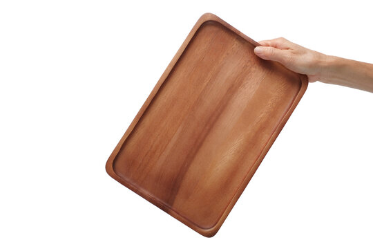 Hand holding empty wooden tray isolated on white, clipping path.