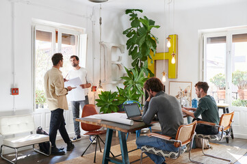 Designers talking together in an office