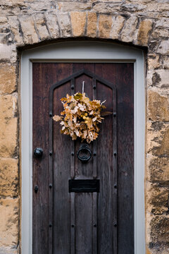 Autumn wreath on an old wooden door