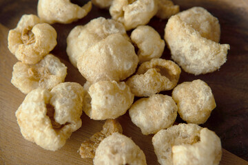 Close-up Pork crackle in wooden plate background