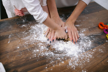 Child making and kneading dough for pie