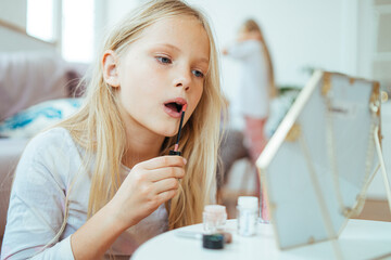 cute girl makes make-up at home