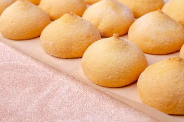Sponge cookies on a cement background.