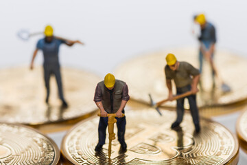 four miners working on bitcoin crypto currency detail