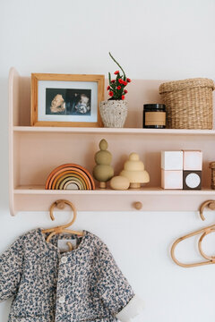 Pink little shelf with kids stuff