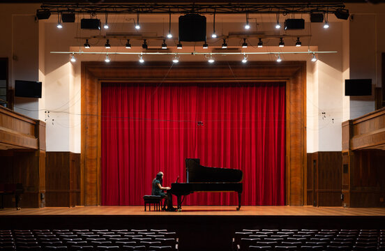 Man and woman, playing a piano