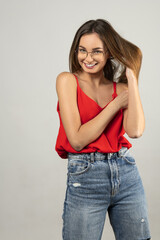 sweet smiling girl with eye glasses and red shirt