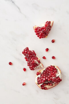 Slices of fresh natural juicy pomegranate fruit.
