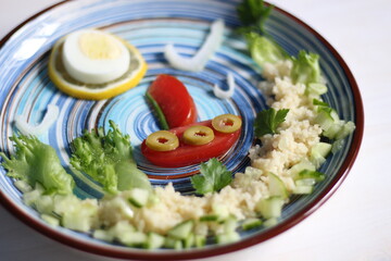 Salad with cuscus, vegetables, egg, created as picture