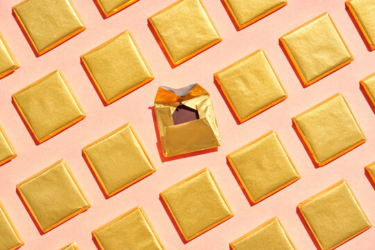 Pieces of chocolate in golden foil