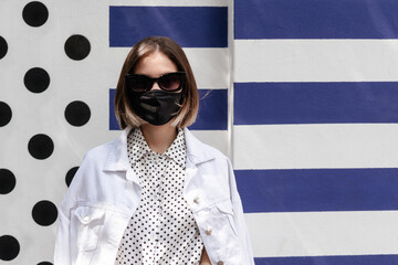 fashion woman with points in a wall with points and blue flags