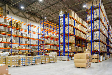 Interior of a modern warehouse storage of retail shop with pallet truck near shelves - obrazy, fototapety, plakaty