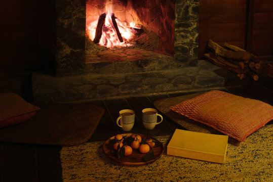 Cozy winter still life near fireplace