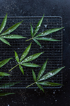 Cannabis leaves with salt and pepper