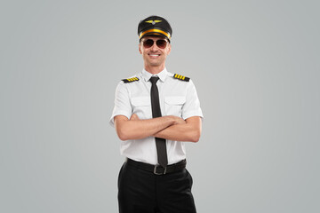 Confident aviator in uniform with arms crossed