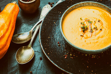 Tasty pumpkin creamy soup in bowl
