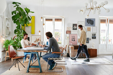 Designer in a mask arriving at work