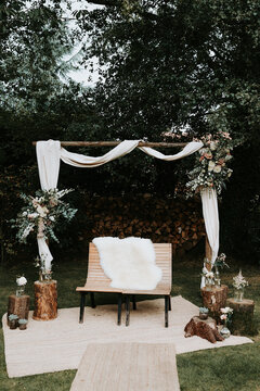 Wooden wedding arch with flowers